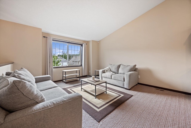 carpeted living room with lofted ceiling