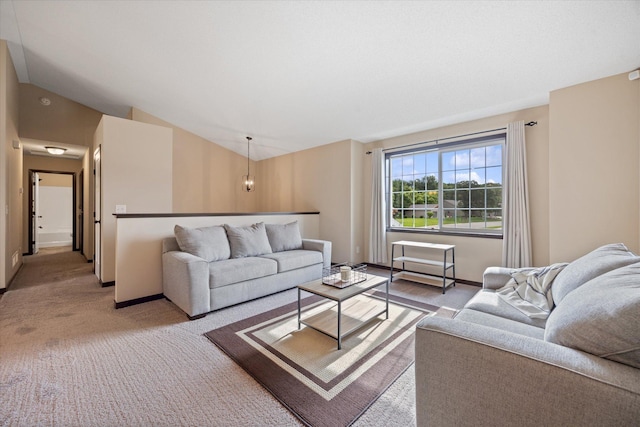 carpeted living room featuring lofted ceiling