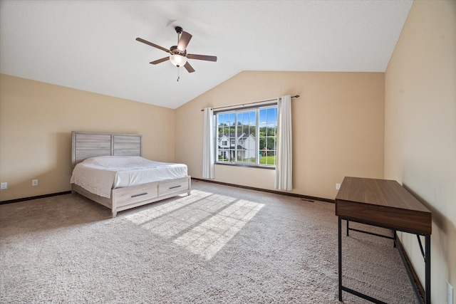 carpeted bedroom with ceiling fan and lofted ceiling