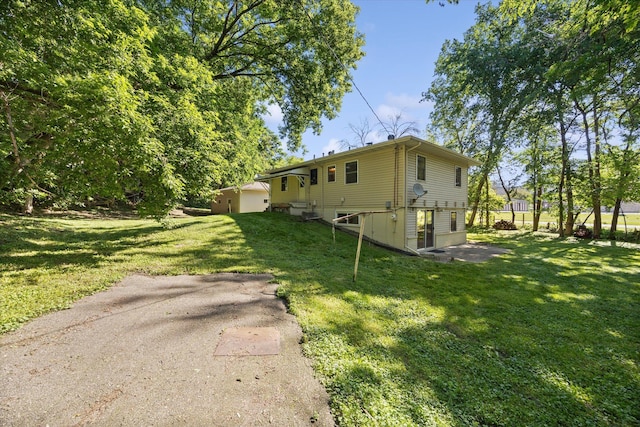 view of property exterior featuring a lawn