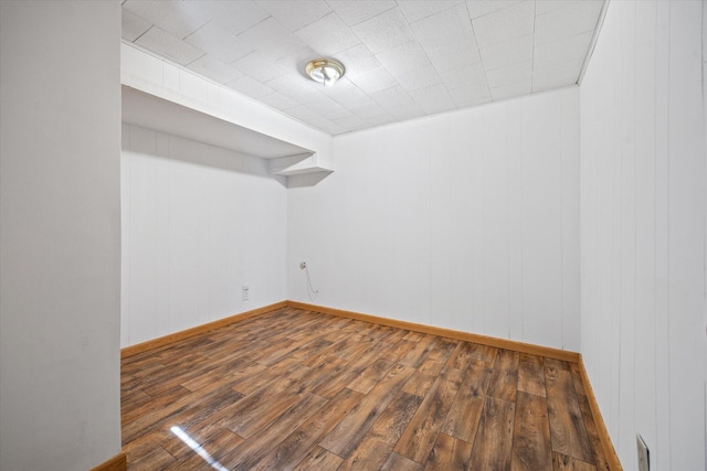 spare room featuring dark hardwood / wood-style flooring