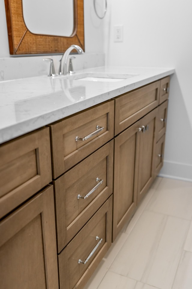 bathroom featuring tile patterned flooring and vanity