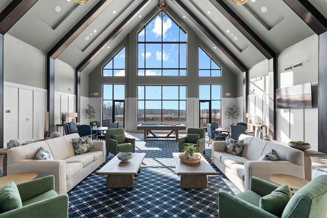 living room with carpet flooring, beamed ceiling, a high ceiling, and billiards