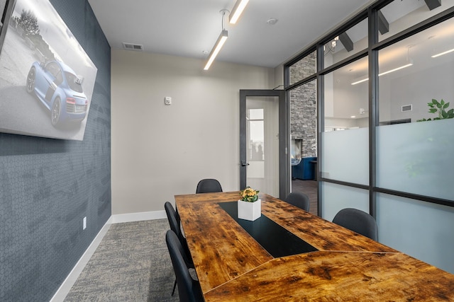 dining area with a wall of windows