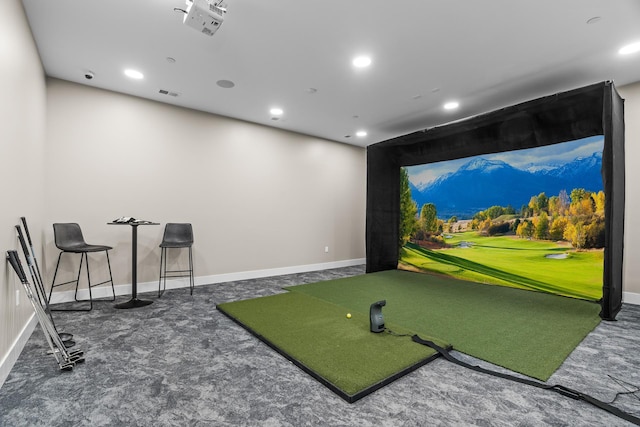 playroom featuring dark carpet and golf simulator