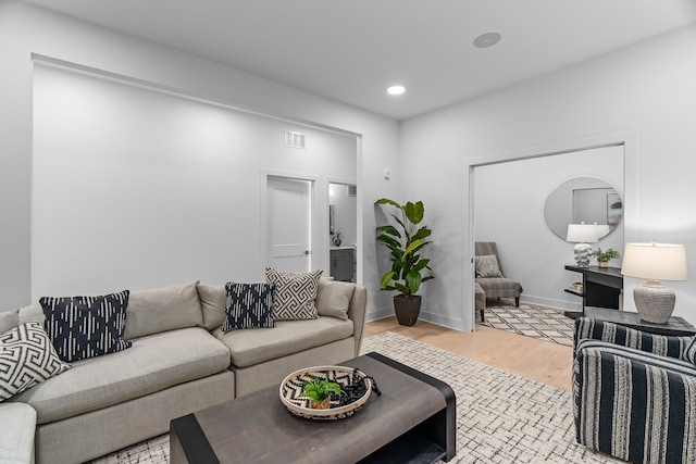 living room with light hardwood / wood-style flooring