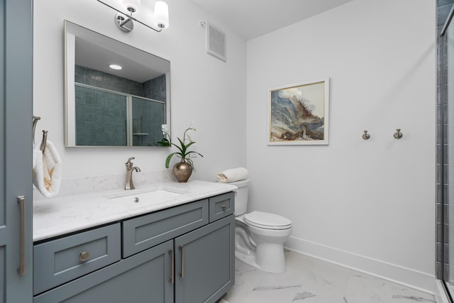 bathroom with tile floors, an enclosed shower, vanity, and toilet