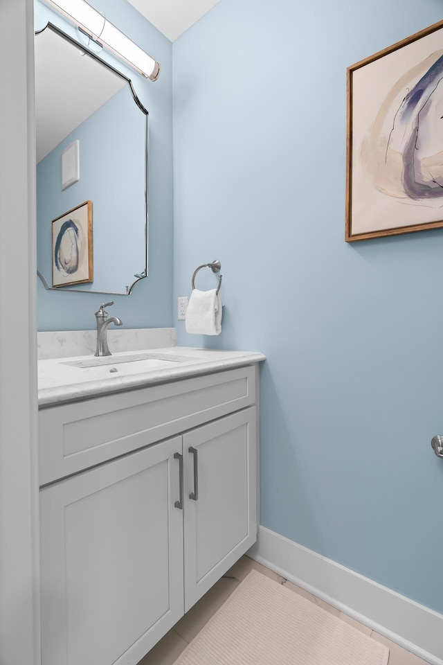 bathroom with tile floors and vanity