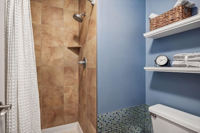 bathroom with toilet and curtained shower