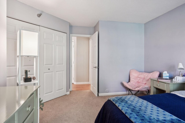 bedroom with light colored carpet