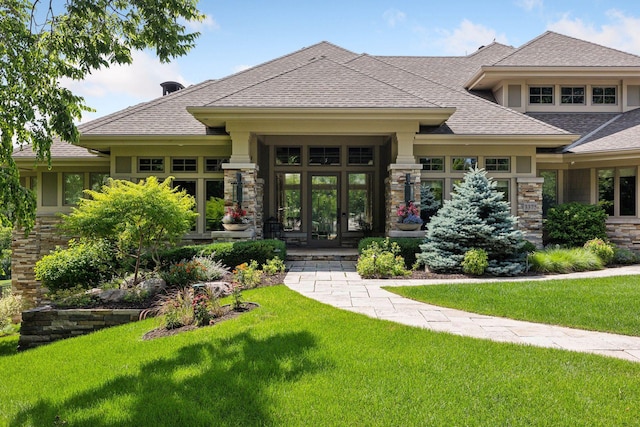 exterior space featuring french doors and a yard