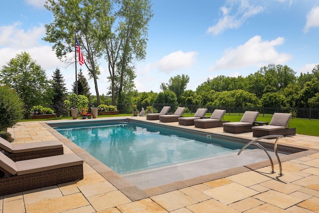 view of swimming pool with a patio