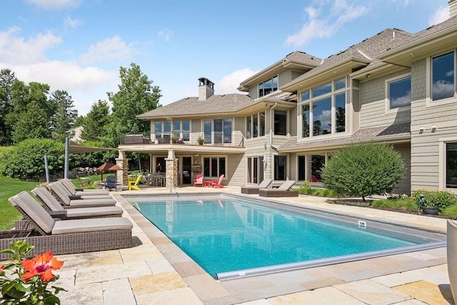 view of pool featuring a patio area