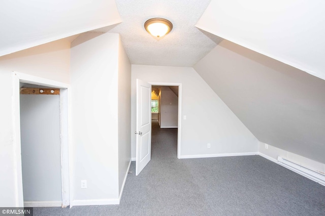 bonus room with carpet floors, a textured ceiling, and lofted ceiling