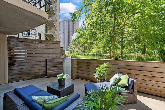view of patio / terrace featuring fence and an outdoor living space