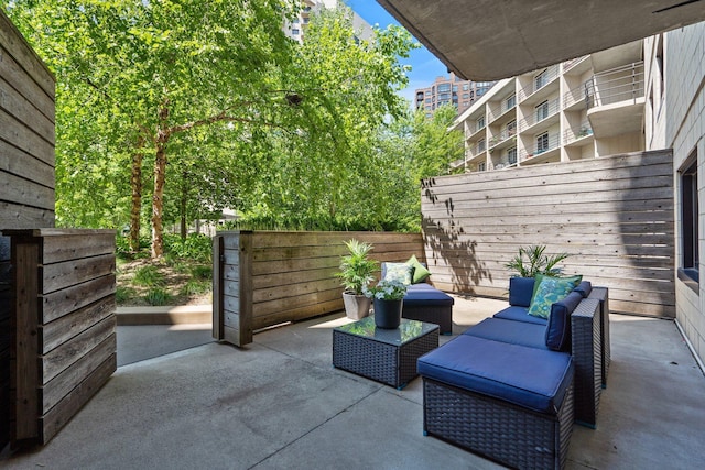view of patio / terrace featuring fence and an outdoor living space