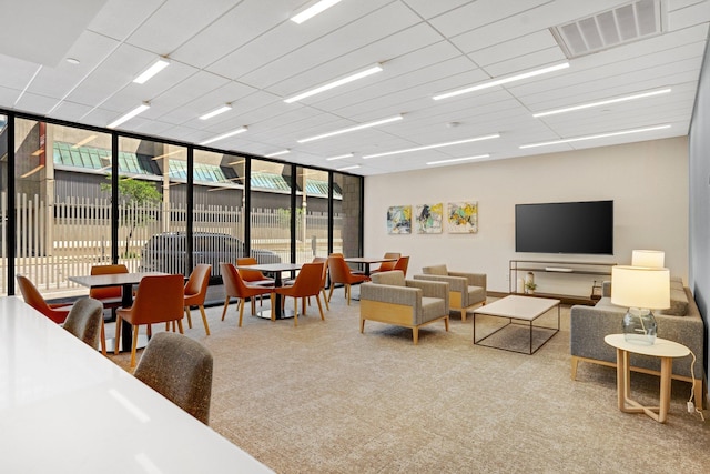 living area with carpet floors and visible vents