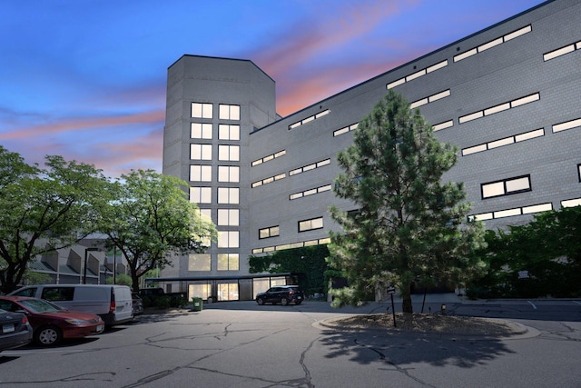 view of outdoor building at dusk