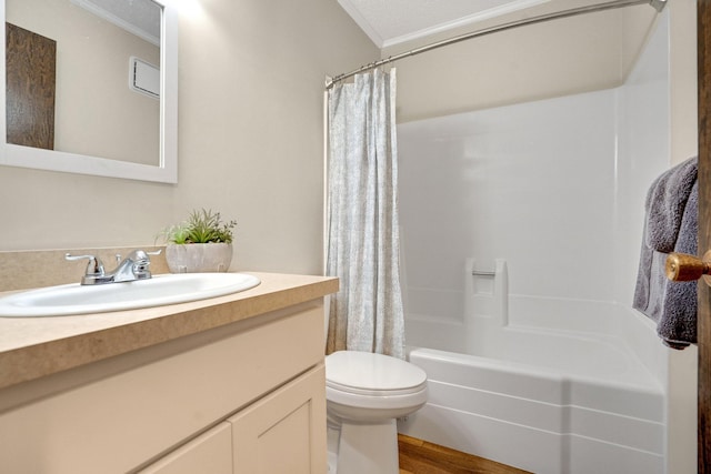 full bathroom with shower / bath combination with curtain, hardwood / wood-style flooring, toilet, vanity, and crown molding