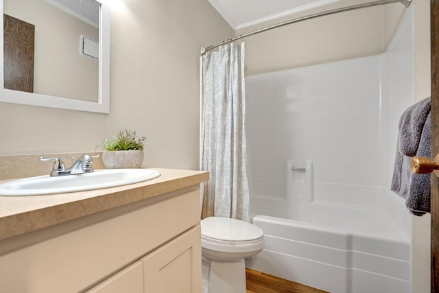 full bath featuring toilet, wood finished floors, shower / bath combo with shower curtain, crown molding, and vanity
