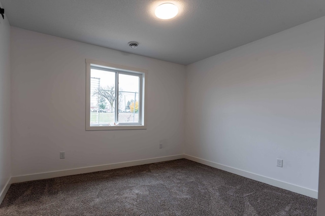 empty room featuring carpet floors