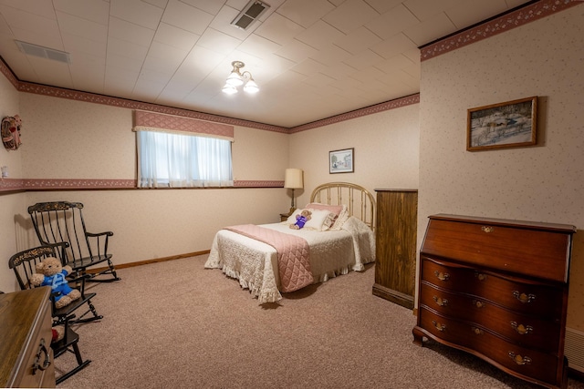 carpeted bedroom featuring crown molding