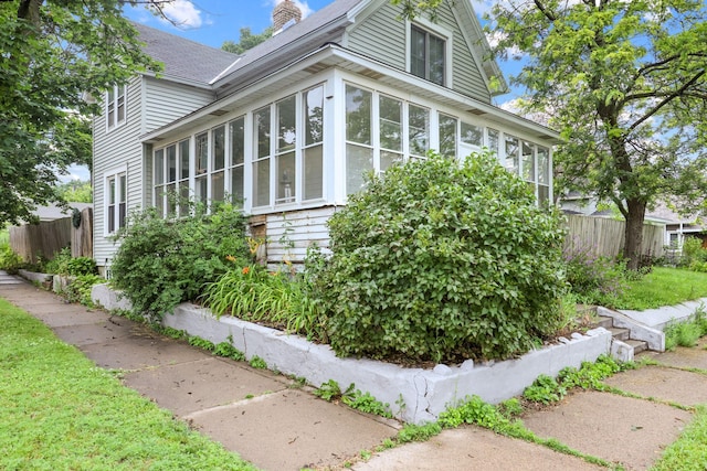 view of side of property with a sunroom