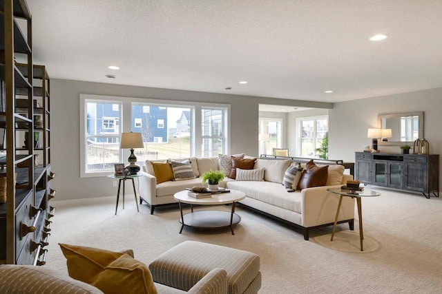 living room with carpet floors and a textured ceiling