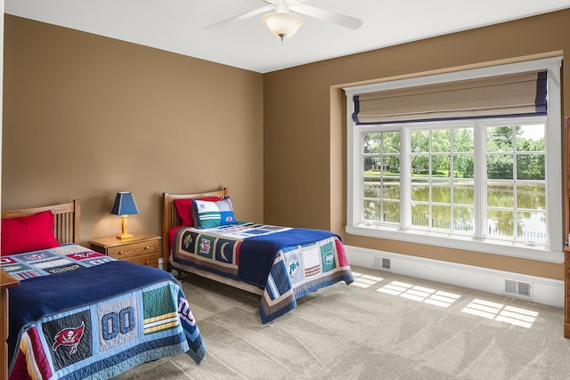 bedroom with ceiling fan and carpet