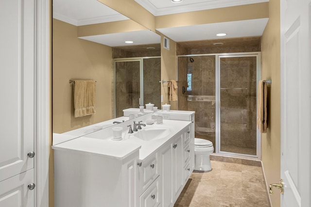 bathroom with toilet, a shower with shower door, and vanity