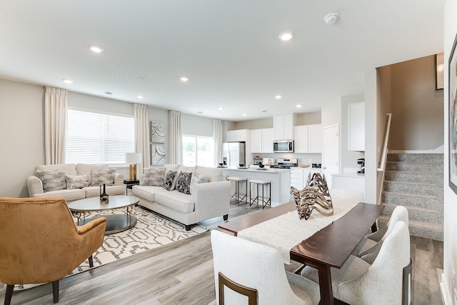 living room with light hardwood / wood-style flooring