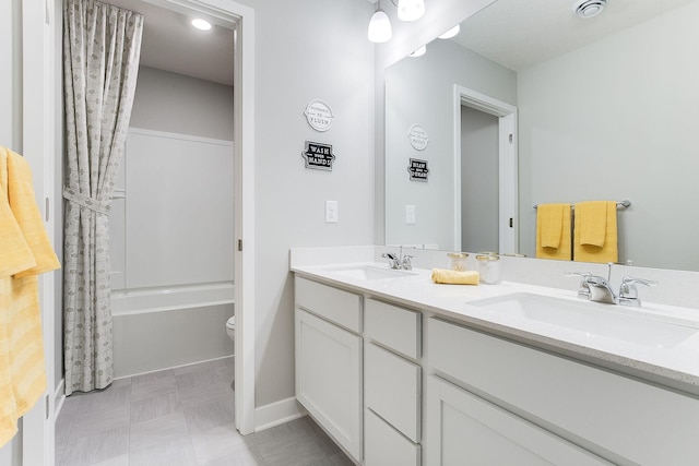 full bathroom with shower / bath combination with curtain, vanity, and toilet