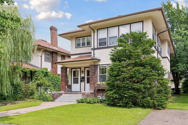 prairie-style house with a front lawn