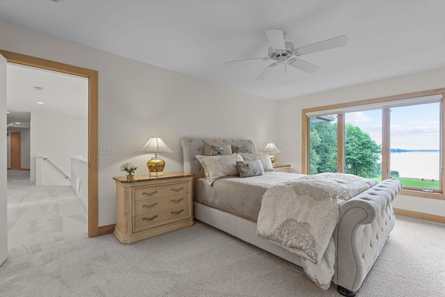 carpeted bedroom with ceiling fan