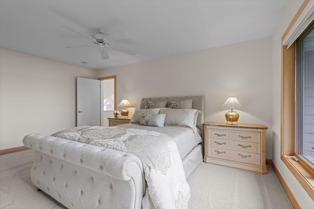 bedroom featuring light carpet and ceiling fan