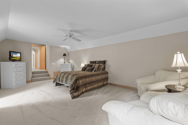 carpeted bedroom with vaulted ceiling and ceiling fan