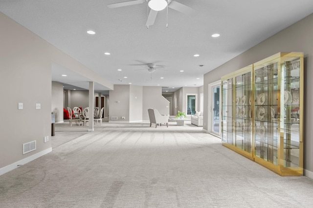 carpeted empty room featuring ceiling fan