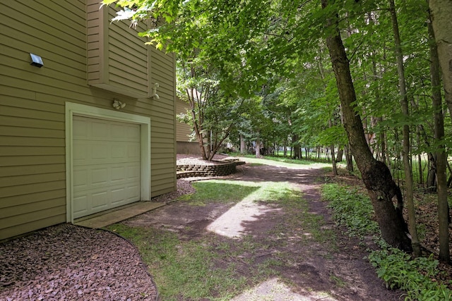 view of yard featuring a garage