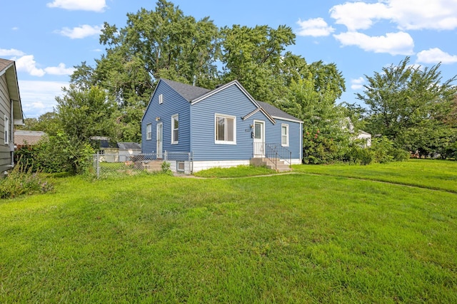 back of house featuring a yard