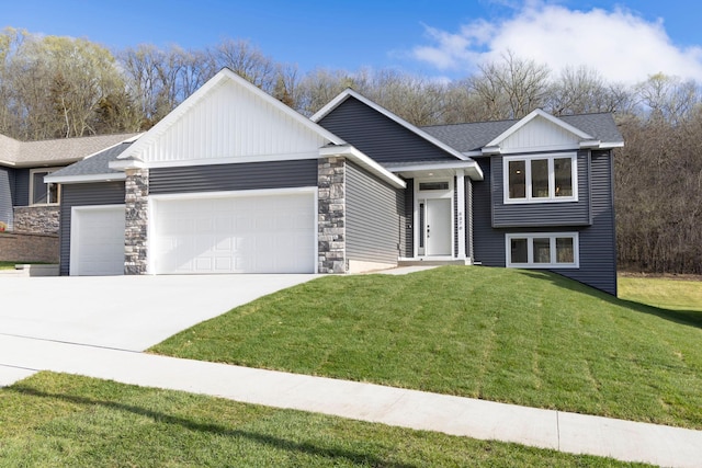 view of front of house featuring a garage and a front lawn