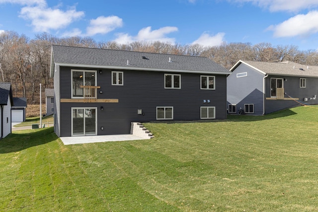 rear view of house with a patio area and a yard