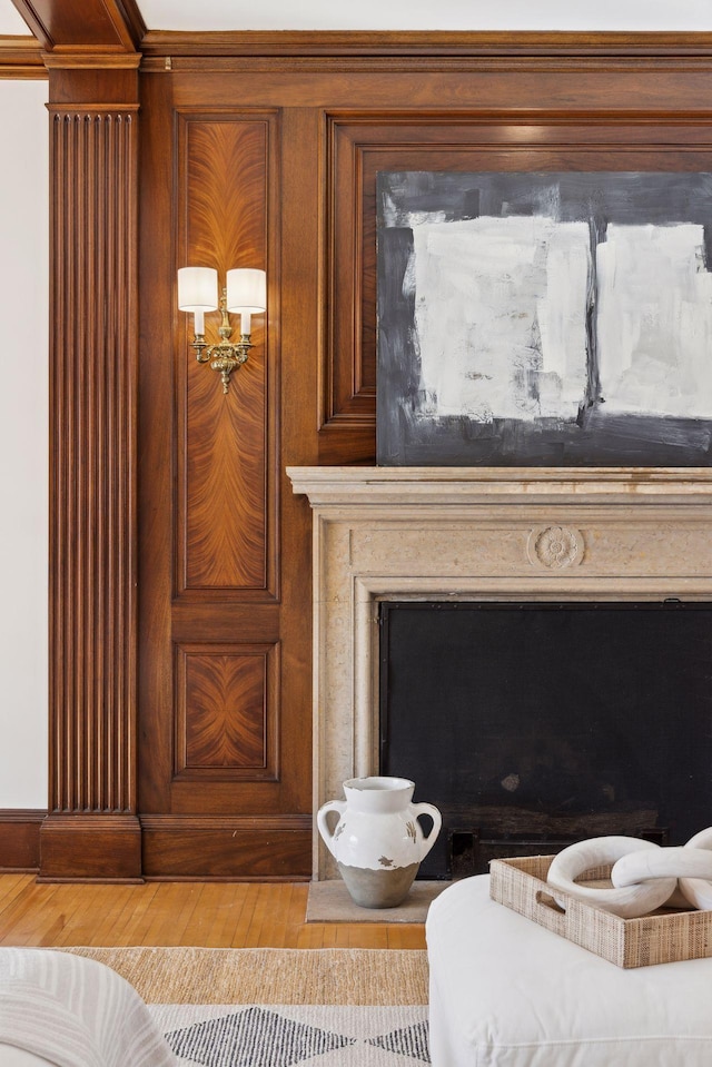 room details with a fireplace and wood finished floors