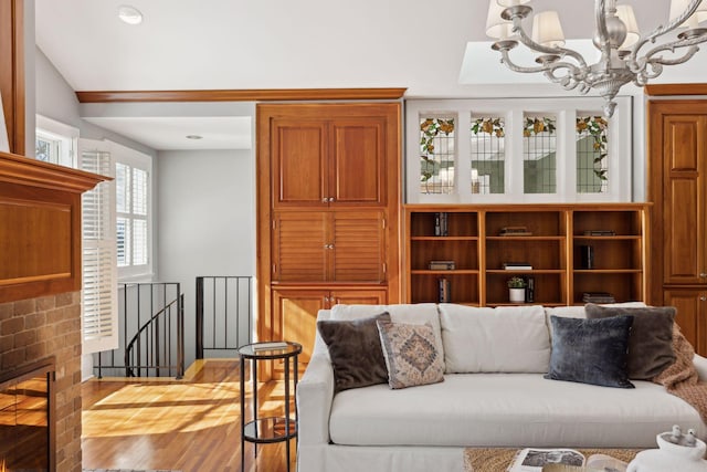 living area featuring a chandelier and wood finished floors