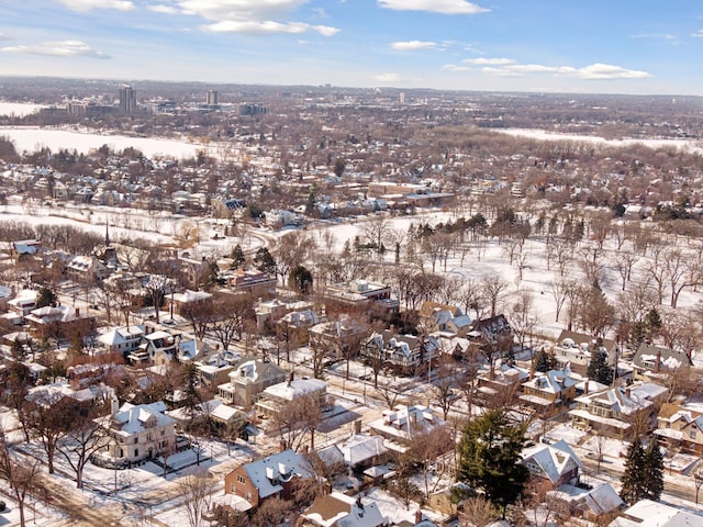 snowy aerial view with a residential view