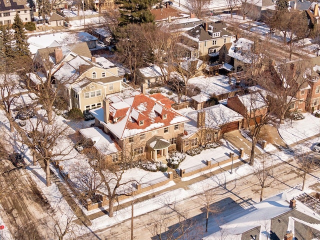 snowy aerial view featuring a residential view