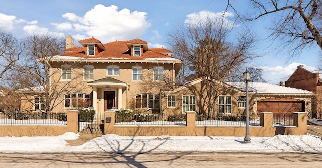 view of front of house featuring a fenced front yard and a chimney