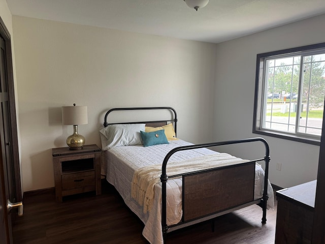 1615 30th St NW Unit 31, Bemidji, MN 56601 - bedroom with dark wood-type flooring