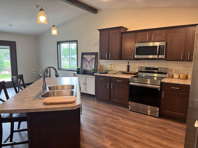 1615 30th St NW Unit 31, Bemidji, MN 56601 - kitchen with appliances with stainless steel finishes, a sink, dark brown cabinetry, and dark wood-type flooring