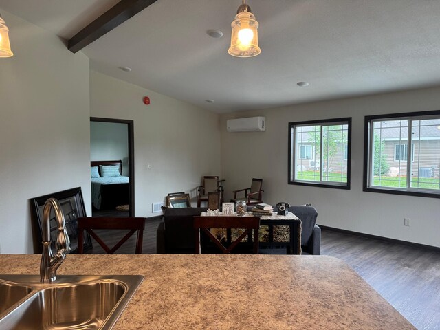 1615 30th St NW Unit 31, Bemidji, MN 56601 - dining area featuring a wall mounted air conditioner, wood finished floors, baseboards, and a desk