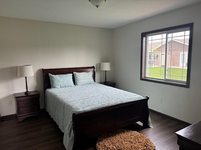 1615 30th St NW Unit 31, Bemidji, MN 56601 - bedroom featuring dark wood-type flooring and baseboards